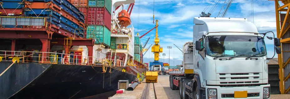 Cargo ship and truck at a container port